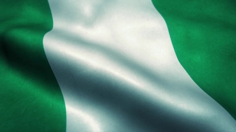 Nigeria flag waving in the wind. National flag of Nigeria. Sign of Nigeria seamless loop animation. 4K