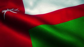 Oman flag waving in the wind. National flag of Oman. Sign of Oman seamless loop animation. 4K