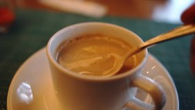 Slow motion video of a cup of coffee