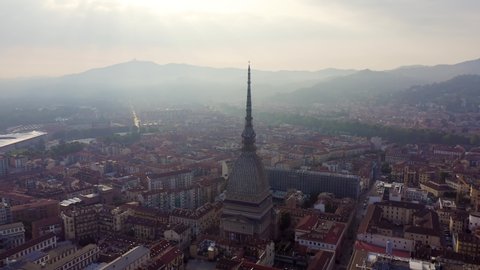 Turin, Italy. Flight over the city. Mole Antonelliana - a 19th-century building with a 121 m high dome and a spire, Aerial View Hyperlapse, Point of interest