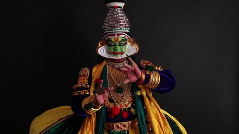 Kathakali dancer depicting an emotion with his gestures.
