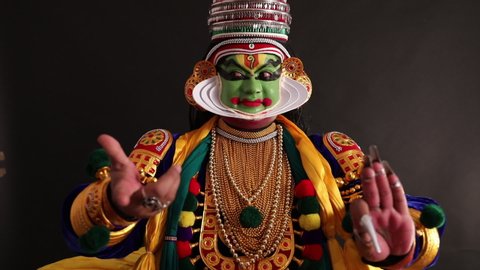 Kathakali dancer expressing through his gestures.