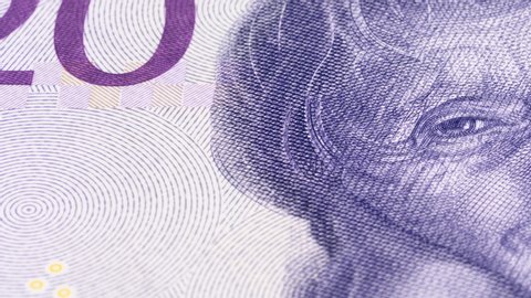 Astrid Lindgren portrait on Sweden 20 krona banknote tracking. Slider shot. Low angle, macro. 4K