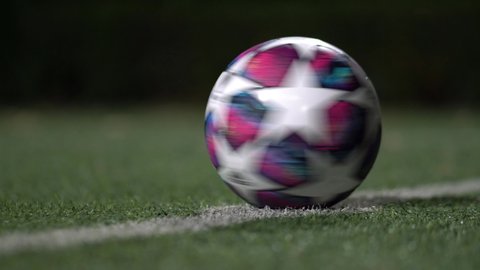 Bangkok / Thailand - Feb 2020 : Adidas "Uefa Champion Leauge (UCL) 2019/20" official match ball, that going to use in knockout round to the final round, is spining on kick-off spot of turf pitch. 
