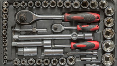 Men tools background. Worker tools and equipment moving close-up. The tool is taken from the case for work, stop motion 4K.