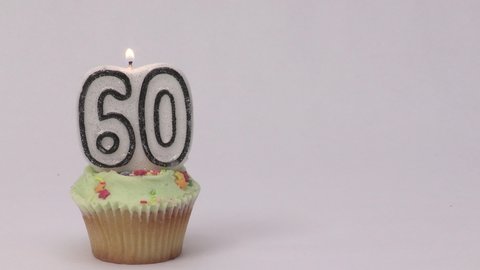 60th birthday cake with a candle