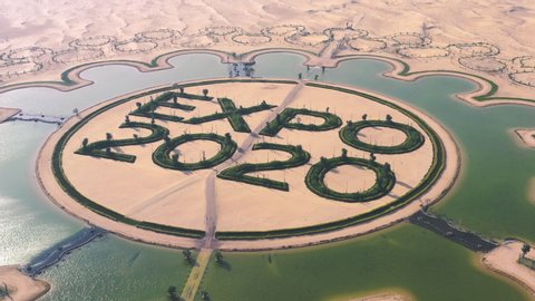Dubai, UAE - February 2020: Circling Aerial shot of man-made artificial EXPO 2020 Lake in middle of Dubai Desert, UAE