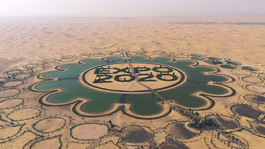Dubai, UAE - February 2020: Aerial shot from desert to man made expo 2020 lake in Dubai desert, UAE