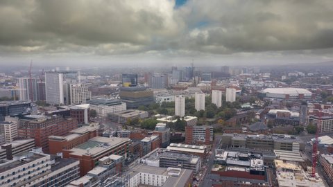 BIRMINGHAM, UK - 2020: Birmingham city skyline UK aerial timelapse with cloud, rain and mist