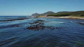 4K summer day aerial drone video: spectacular Bordjiesrif beach at Vasco Da Gama Cross. Cape of Good Hope, most popular tourist attraction, near Cape Town in Cape Peninsula, Western Cape, South Africa
