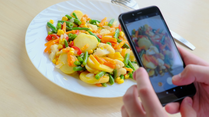 Hands Taking Picture Of Vegan Food Using Cell Phone, Close up