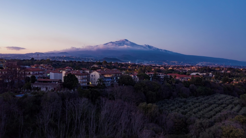 Aerial hyperlapse view of mount Etna in Sicily after sunset (timelapse)
