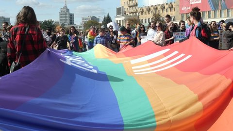 KHARKIV, UKRAINE - September 15, 2019: People wave LGBTQ gay pride flags