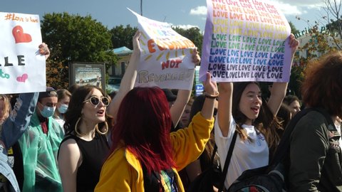 KHARKIV, UKRAINE - September 15, 2019: People hold huge rainbow stuff at Gay Pride parade. Claiming for equality and legal rights for LGBTQI+ community. Rainbow flag at gay or lesbian pride parade