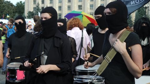 KHARKIV, UKRAINE - September 15, 2019: Claiming for equality and legal rights for LGBTQI+ community. Rainbow flag at gay or lesbian pride parade. Drummer demonstrators for tolerance route