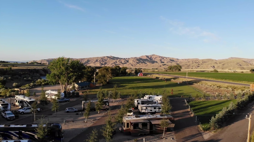 Aerial Drone Shot RV Park and Farm Beautiful Wyoming Countryside at Sunset in 4k. 
