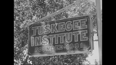 CIRCA 1940s - Civilian and servicemen students are seen on campus at Tuskegee University.