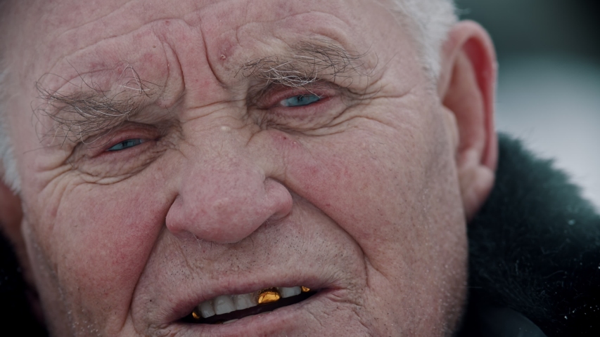 Elderly grandfather - old grandfather is speaking with a sad face