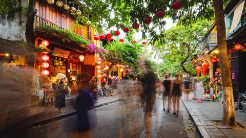 Hoi An / Vietnam - 10 20 2019: City Center Street daytime with tourists walking. Ancient Town with Colonial Building. Hoi An, Vietnam.