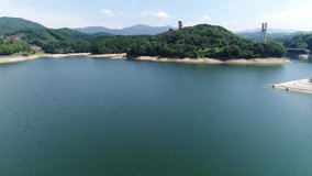 
Video shooting of Japanese dam from above.
Lush lake.
Drone shooting