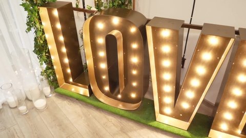 big wooden word love whith lights