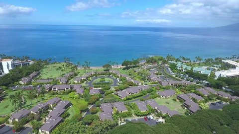 Wailea Makena , Hawaii / United States - 01 02 2020: Wailea Elua Village orbit aerial shot during summer, blue ocean in background.