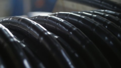The copper winding of the cable on the reel. Production of electric cable.