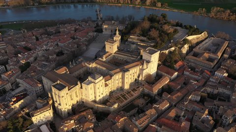 Palace of the Popes medieval Gothic building architectural landmark France Avignon aerial sunrise shot 