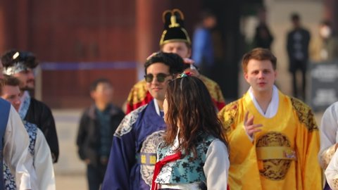 Seoul,South Korea-March 2018: Foreign tourists walking while wearing Korean traditional clothes, Hanbok, at Gyeongbokgung Palace, Seoul,South Korea.