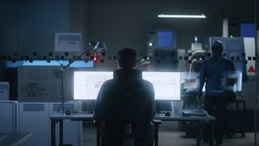 Industrial Engineer Solving Problems, Working on a Personal Computer, Two Monitor Screens Show CAD Software with 3D Prototype of Eco-Friendly Electric Engine Concept. Back View Zoom in - Powered by Shutterstock - Get 15% off with code: PIKWIZARD15