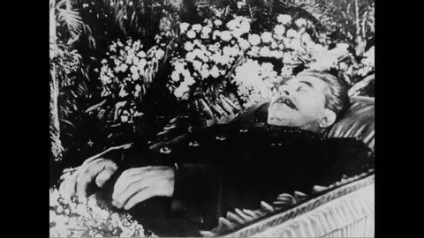 CIRCA 1953 - Joseph Stalin's funeral procession is seen in Moscow, and flowers are left at his tomb.