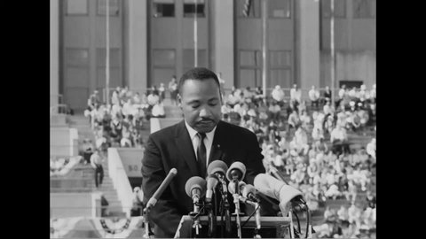 CIRCA 1964 - At the Chicago Freedom Movement rally at Soldier Field, Martin Luther King condemns segregation.