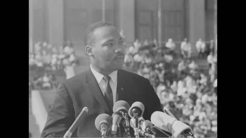 CIRCA 1964 - At the Chicago Freedom Movement rally at Soldier Field, Martin Luther King stresses the importance of non-violence.