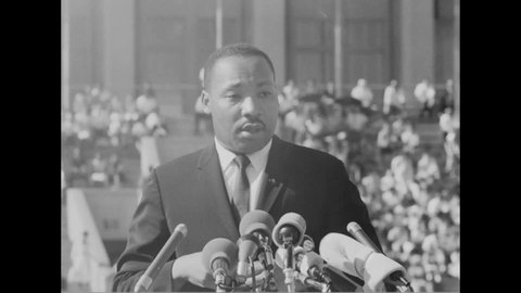 CIRCA 1964 - At the Chicago Freedom Movement rally at Soldier Field, Martin Luther King urges listeners to vote.