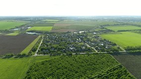 Russian village among grain fields and gardens, overlooking the lake. Flying back. The Village Of "Muscat". Perspective.
 - Powered by Shutterstock - Get 15% off with code: PIKWIZARD15