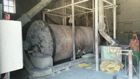 Sirohi Road, India - February 20 2020: Ball mill grinding the stones to make fine mineral powder