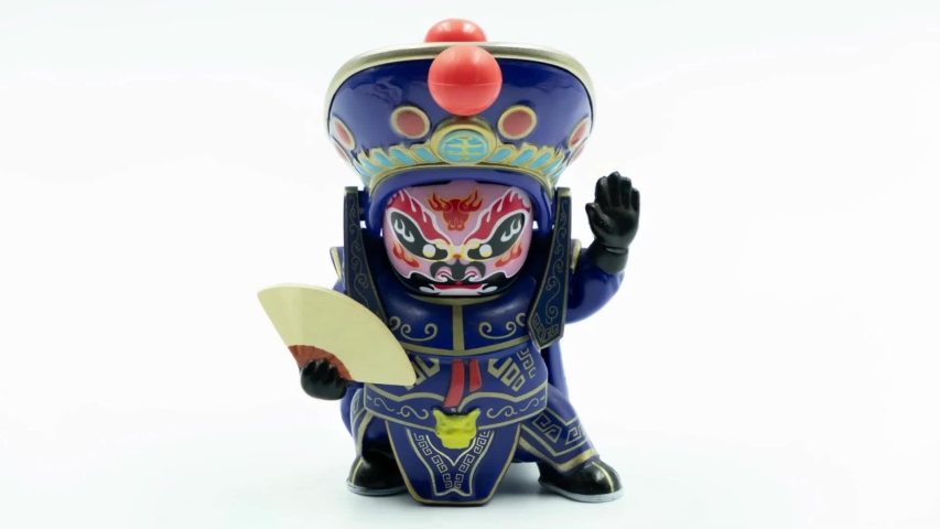 The Sichuan Chengdu China Opera Mask Changing Doll with the colorful mask and Costume isolated on White Background