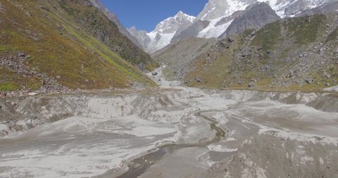 Aerial 4k shot of Himalayan Range Himalaya mountain, Garhwal Himalaya Region, Uttarakhand India near Kedarnath shrine. Natural waterfall from Himalayas.Himalaya Valley. Travel mountains & peaks.