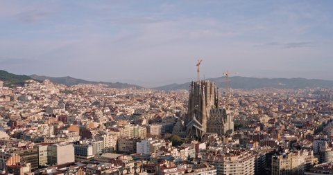 Barcelona / Spain - 02 26 2020: La Sagrada Familia Cathedral, Aerial over the city of Barcelona famous attraction