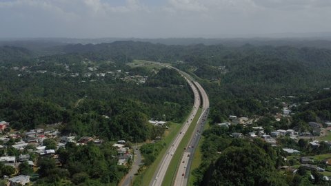 Aerial establishing shot of a residential area in Puerto Rico. Cinematic 4K footage.