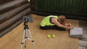 Fitness instructor making an online broadcast of her classes