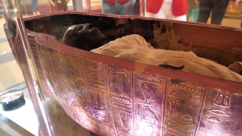 EGYPT, CAIRO, DECEMBER 11, 2019: Sepulcher with real ancient Egyptian mummy in museum of Egyptian antiquities in Cairo
