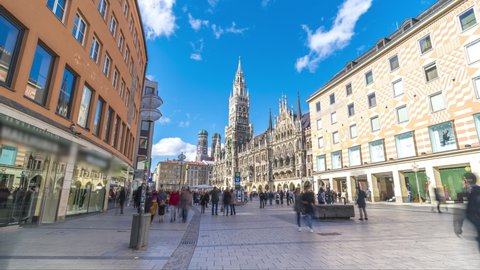 Tourists at the Marienplatz street in Munich Germany view in front of Town Hall catedral. The Marienplatz is central square in the city centre of Munich, Germany. Hyperlapse footage Skyline Munich.  