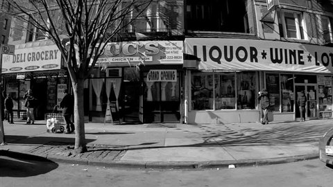 NEW YORK - FEB 9, 2010: taxi cab and liquor wine store, Upper West Side, Manhattan, black and white vintage style footage, driving in NY. Upper Westside is a famous neighborhood in Manhattan, NYC.