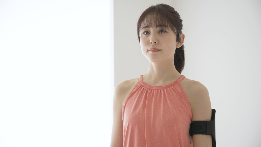 Young woman operates wearable device