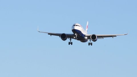 Feltham, London, England, UK - Jan 18th, 2020 - British Airways airplane flying into London Heathrow airport. Sunny sky. Selective focus.