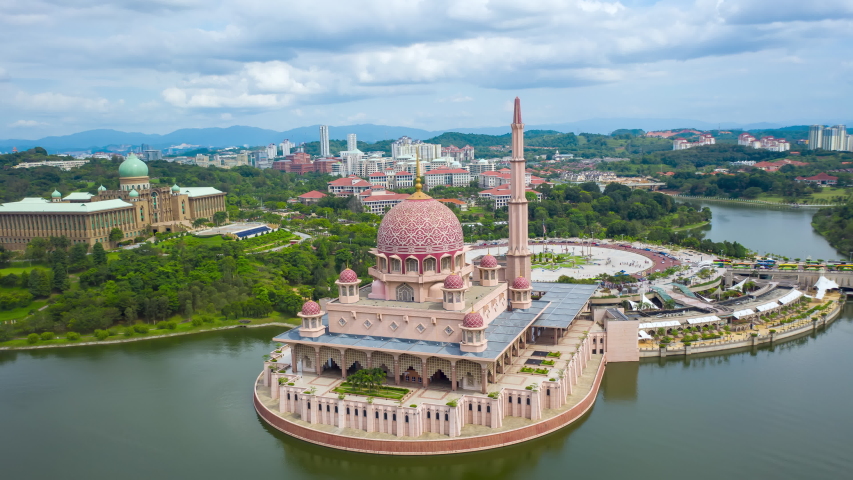 aerial view hyperlapse 4k video of Putra Square With Putra Mosque And Perdana Putra Putrajaya Malaysia. Hyper lapse by drone. (Public places) Royalty-Free Stock Footage #1047521350