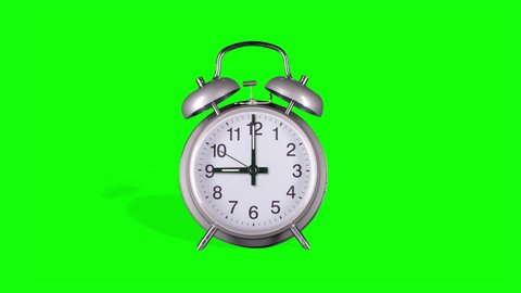 Vintage alarm clock on green screen, alarm at 12 o'clock 