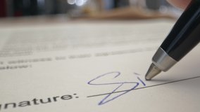 Signature by Pen in Male Hand. Sign Document on Deal at Office Work Indoors. Write Business Agreement or Underwrite Information in Contract. Initials of Partner on Registration Certificate or License - Powered by Shutterstock - Get 15% off with code: PIKWIZARD15