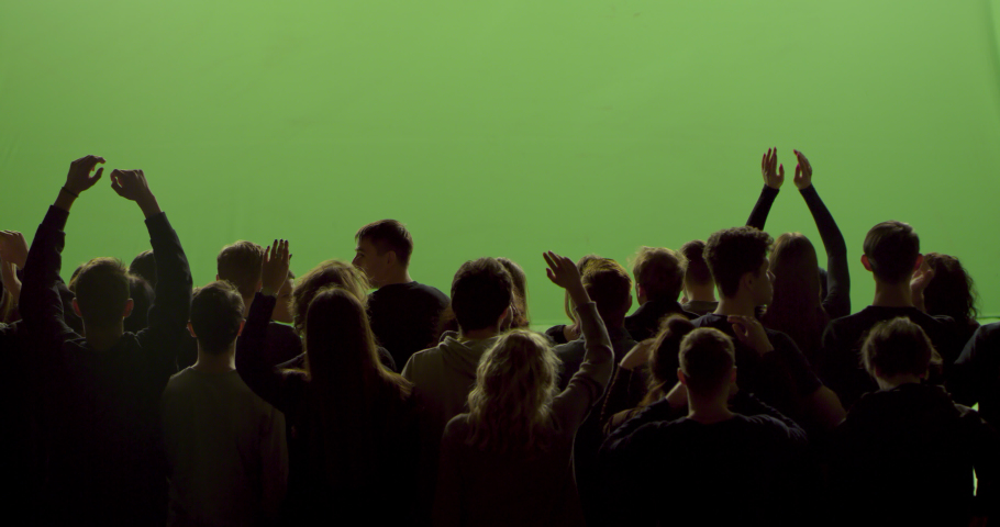 GREEN SCREEN CHROMA KEY Model released, back view of huge crowd dancing and cheering at a concert or a show. Shot on RED Helium 8K in RAW Royalty-Free Stock Footage #1047561997